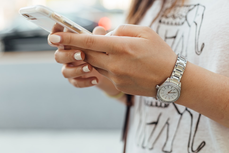 Person using mobile phone for communication